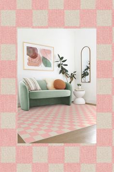 a living room with pink and white checkered rugs on the floor next to a green couch