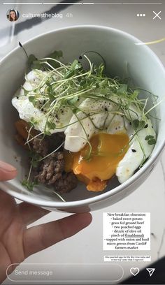 a person holding a bowl with food in it on top of a white countertop