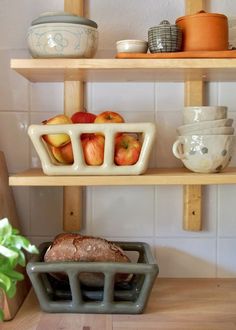 some shelves with bowls and food on them