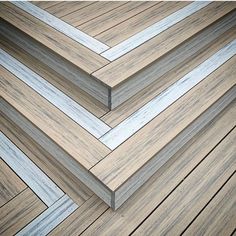 several pieces of wood sitting on top of a wooden flooring planked area with white and gray lines