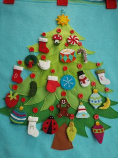 a christmas tree made out of felt and buttons