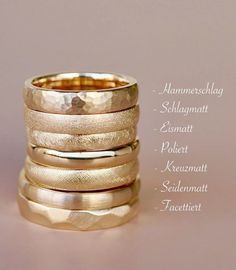 four different types of wedding rings with names in german and english on the bottom row