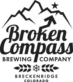 the logo for broken compass brewing company, with mountains in the background and stars above it