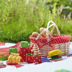 a picnic table set up with food and snacks