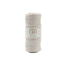 a spool of white twine with the word ef on it, in front of