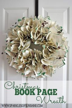 a christmas book page wreath hanging on a door with the words, christmas book page wreath