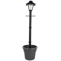 The Cape Cod Plug-In Outdoor Black Post Lantern with Planter adds charm to any outdoor area. A turn-of-the-century gas flame lantern design blends the beauty of the past with the efficiency of the present. These portable, electric weatherproof patio lamps feature an elegant lantern design, frosted bevel panes and all resin construction. Dimensions: 82 in. tall, 21 in. Dia planter. Turn-of-the-century gas flame lantern design All resin construction 2 level dimming switch Weatherproof cord and plug Features Item Weight 23 Number of Bulbs Required 1 Outdoor Lighting Features Waterproof,Weather Resistant Recommended Light Bulb Shape Code A19 Fixture Material Plastic Style Classic,Mediterranean Voltage Type Low Voltage Light Bulb Type Included No Bulbs Included Exterior Lighting Product Type Po Diy Garden Flowers, Lawn And Garden Ideas, Patio Lamp, Outdoor String Lights Patio, Diy Curb Appeal, Everyday Crafts, String Lights In The Bedroom, Hanging String Lights, Wrought Iron Decor