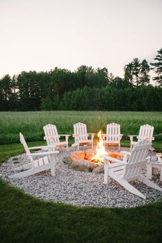 a fire pit with chairs around it