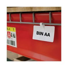 a red bin with a white tag that says bin aa