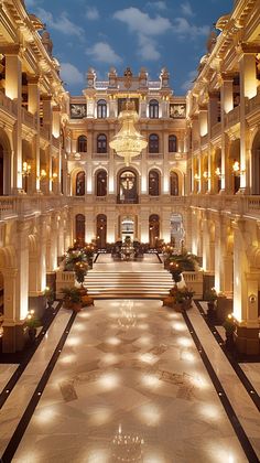 the inside of a large building with lights on