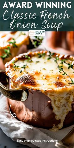 a casserole dish with cheese and herbs in it on a white plate, text overlay reads award winning classic french onion soup