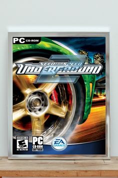 the cover art for the game need for speed underground pursuit on display in front of a white wall