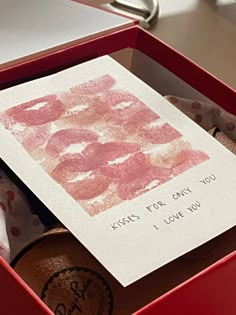 a card in a red box that says kiss for only you and i love you