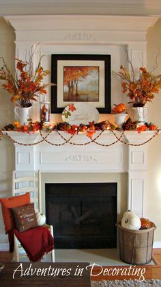 a fireplace mantel decorated with fall leaves and pumpkins