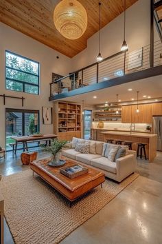 Modern compact barndominium interior with open layout high ceilings large windows built-in shelving and multifunctional furniture Rural Living, Compact Living, Home Building, Exposed Beams, Smart Home Technology