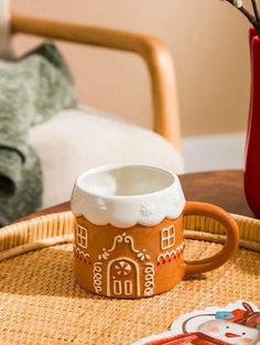 a coffee cup sitting on top of a wicker tray