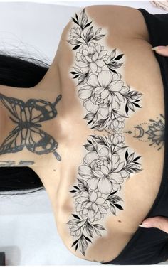 a woman with tattoos on her stomach and back