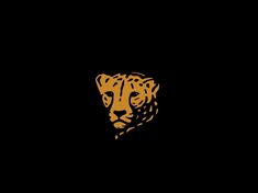 a black background with a gold colored tiger head on it's left side in the center