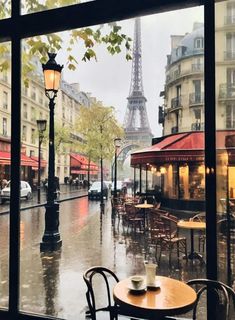 an empty cafe with the eiffel tower in the background