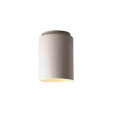 a light that is on the side of a white wall mounted ceiling fixture in an empty room