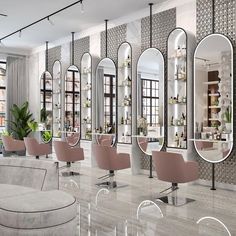 the salon is decorated in pink and white with lots of mirrors on the wall above it