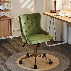 a green office chair sitting on top of a rug in front of a computer desk