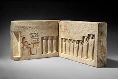 an ancient book with egyptian writing and pictures on the front cover, open to show images of people sitting at a table