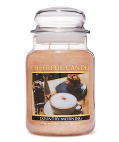 a jar that has some kind of food inside of it on a white surface with the words, cheerful candii country morning