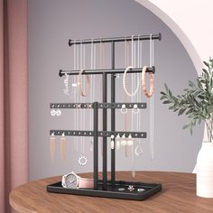 there is a jewelry rack on the table