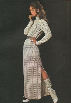 a woman in a white crochet dress and boots is talking on the phone