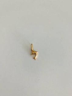 14K Gold Dolphin Pendant | Yellow Gold Dolphin Pendant | Dolphin Pendant | 14K Solid Gold Pendant⁙ Materials: 14K Yellow Gold⁙ Dimensions: 9MM Height by 8MM Width, the opening of the ring (jump ring) is 3MM wideProduction Times:⁙ Order processing time varies between 1-3 business days⁙ All orders placed on Saturday, Sunday, or on a national holiday will begin processing the following business day Diy Pearl Necklace, Dolphin Pendant, Om Necklace, Dolphin Necklace, Modern Gold Jewelry, Wallpaper Girly, Heart Necklaces, National Holiday, Pearls Diy