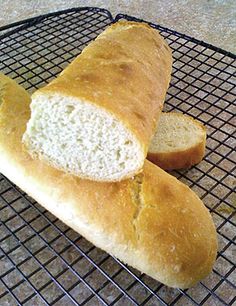 two loaves of bread on a cooling rack