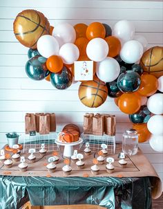 a basketball themed birthday party with balloons and cupcakes