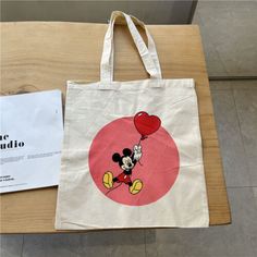 Find ideas๏ฟฝand inspiration for Pretty Mickey Mouse 100% Thick Canvas Cotton Beige Handle Tote Bag L, Womens Bags Handbags Canvas Bag Painting, Disney Tote Bag, Painted Canvas Bags, Disney Tote Bags, Disney Tote, Women's Bags, Xmas Gifts, Canvas Bag, Bags Handbags