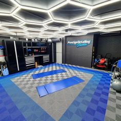 a garage with blue and gray checkered flooring