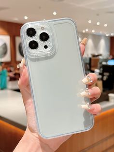 a woman holding up her phone case in front of the camera