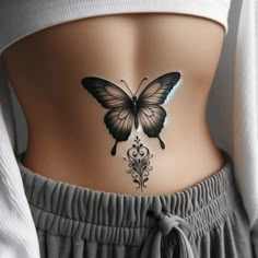 a woman with a butterfly tattoo on her stomach