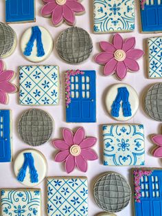 decorated cookies with blue and pink decorations on a table