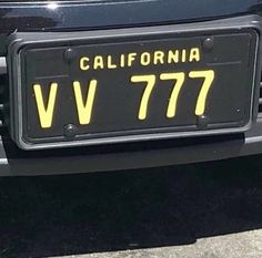 the license plate is on the back of a car that says california v777