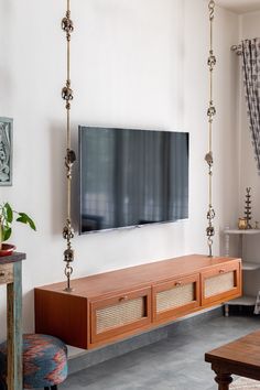 a flat screen tv mounted to the side of a wall