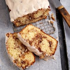 two slices of cinnamon roll cake on a cooling rack