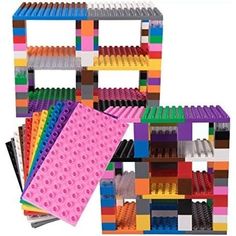 several legos are stacked on top of each other with different colors and shapes in them