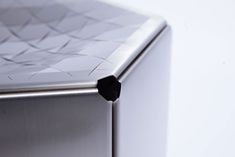 a close up view of the front end of a silver refrigerator