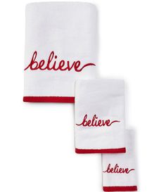 two towels with the words believe and believe embroidered on them, both in red ink