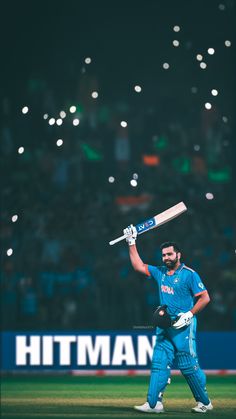 a man holding a bat on top of a field