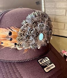 Natural feather hat band. Brown feathers with black iridescent tips. Center crown measures 2.5" W x 2.25" H. Adjustable with leather lace ties. Natural feathers- handmade Adjustable hatband *This product is for 1 single hat band. Hat not included. Due to the delicate nature of feathers they may become ruffled or slightly out of shape while in transit. Apply steam lightly with a clothing steamer or tea pot for 3-4 seconds to straighten out the feathers. Hold feather approximately 6 inches from st Luxury Adjustable Hat Bands For Party, Feather Clips For Hats, Lace Hat Bands, Luxury Hat Bands With Flat Crown For Formal Occasions, Leather Belt Hat Band, Hat Bands Diy Ideas, Feather Hat Band, Feathered Hat, Clothing Steamer