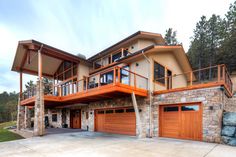 a large house with two car garages on top of it