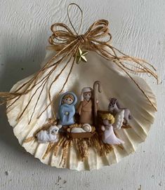 a nativity ornament hanging on a wall