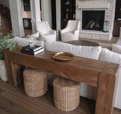 a living room filled with furniture and a fire place