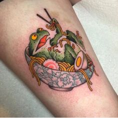 a tattoo on the leg of a person with food in a bowl and chopsticks